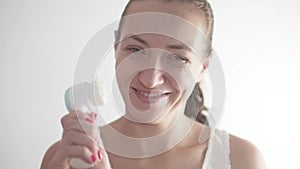 Woman applies Moisturizer face mask