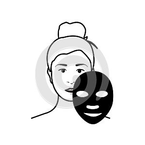 Woman apply charcoal mask on her face isolated on white background