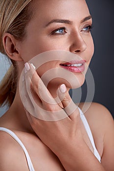 Woman applying anti-aging cream