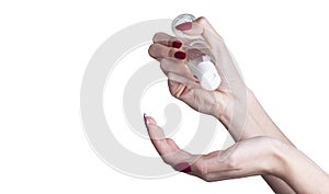 Woman applying an antibacterial antiseptic gel for hands disinfection and health protection during flu virus outbreak.