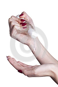 Woman applying an antibacterial antiseptic gel for hands disinfection and health protection during flu virus outbreak.