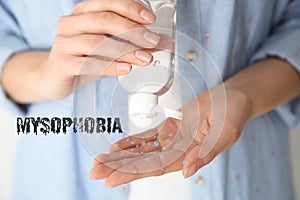 Woman applying antiseptic gel on hand. Mysophobia