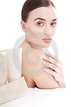Woman with applying beauty product.