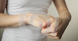 Woman applying body cream on hand