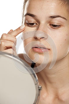 Woman applying concealer