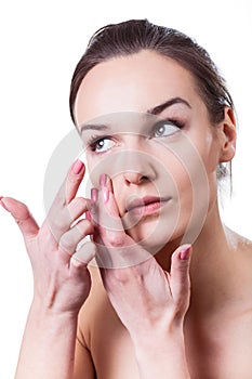 Woman applying contact lenses