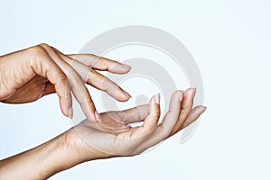Woman applying cream gesture hand stock photo