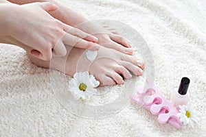 Woman applying cream on her feet
