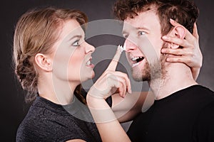 Woman applying cream to her man face.