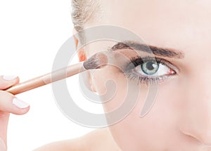 Woman applying daytime make-up