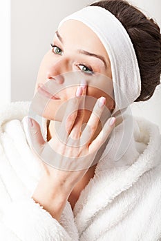 Woman applying eye cream