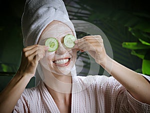 Woman applying facial mask