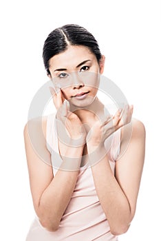 Woman applying facial moisturizer cream for sensitive skin