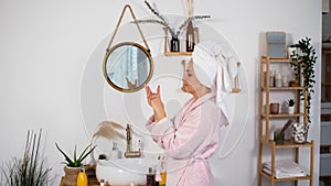 Woman Applying Hand Creme After Taking Shower