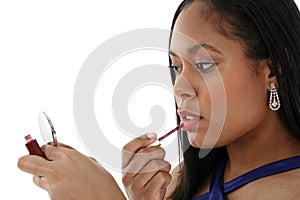 Woman applying lip gloss