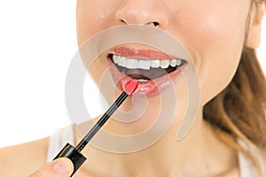 Woman applying lipstick