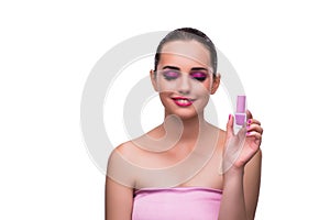 The woman applying lipstick isolated on white