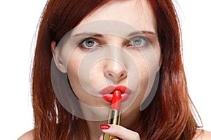 Woman applying lipstick for lips.