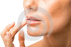 Woman Applying Lubricating Lip Cream