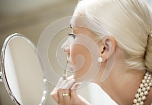 Woman applying make-up