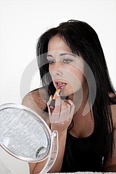 Woman applying make-up