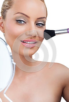 Woman applying make-up