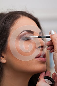 Woman applying make-up