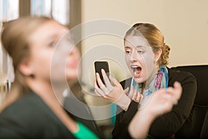 Woman Applying Makeup Using her Phone as a Mirror