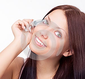 Woman applying mascara