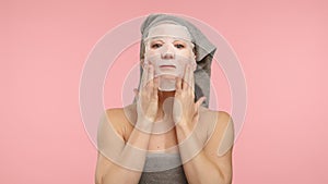 Woman applying moisturising face mask for skincare routine