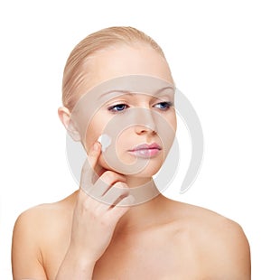 Woman applying moisturize cream. photo