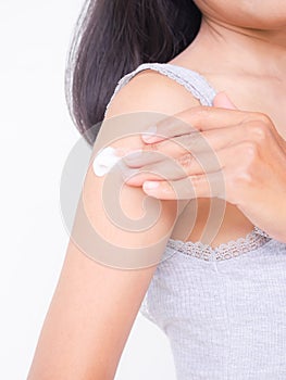 woman applying Moisturizer cream body lotion to hand after bath