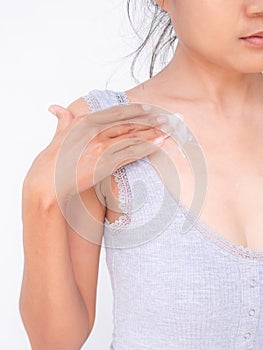 woman applying Moisturizer cream body lotion to hand after bath in home.