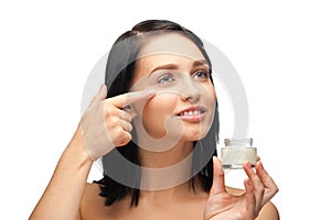 Woman applying moisturizing cream