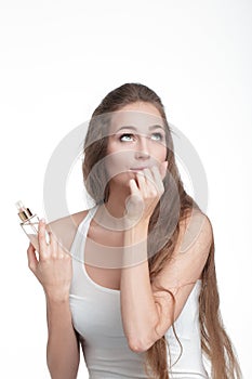 Woman applying perfume on her wrist