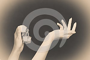 Woman applying perfume on her wrist