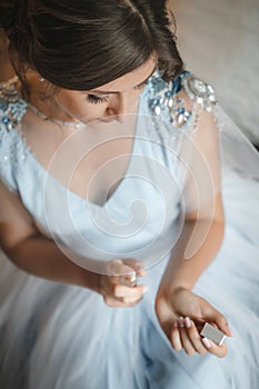 Woman applying perfume on her wrist