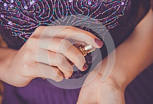 Woman applying perfume on her wrist