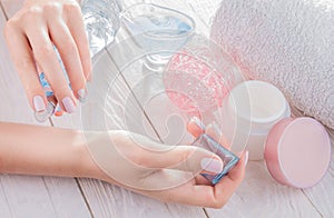 Woman applying perfume on her wrist