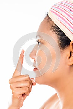 Woman applying some facial cream