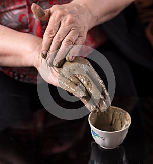 Woman applying spa cosmetic clay cream