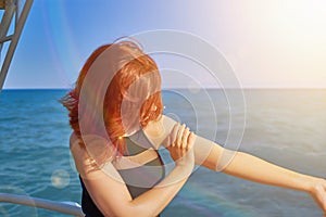 Woman applying sun protection lotion.