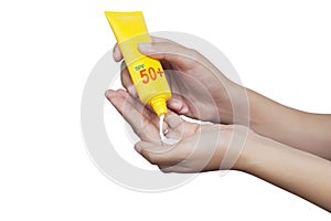 Woman applying sunscreen on her hand isolate on white background photo