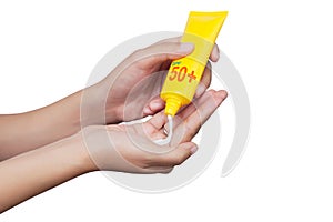 Woman applying sunscreen on her hand isolated on white