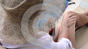 Woman Applying Sunscreen Lotion On Body. Female Using Sun Block Cream Or Protective Moisturizer Before Sunbathing On