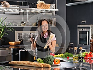 Woman in apron on modern kitchen