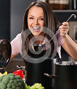 Woman in apron on modern kitchen