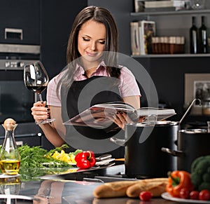 Woman in apron on modern kitchen