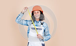 woman architect in helmet. girl in checkered shirt and protective hard hat. building and construction site. Builder