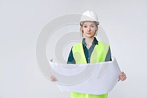 Woman architect in white hard hat with drawings on white background